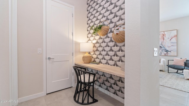 home office featuring tile patterned floors and baseboards