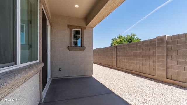 view of patio / terrace featuring fence