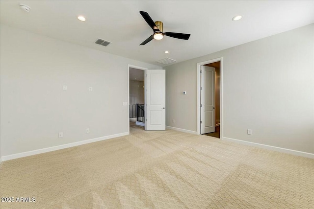 unfurnished bedroom with light carpet and ceiling fan