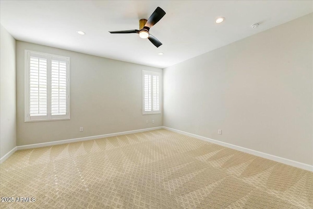 empty room with light carpet and ceiling fan