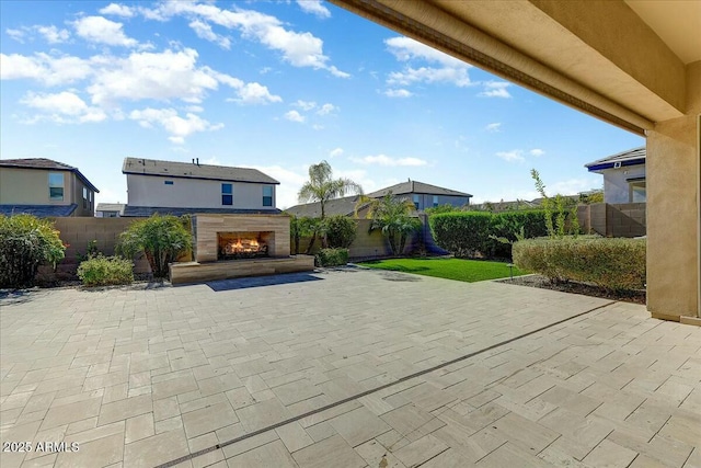 view of patio / terrace with exterior fireplace