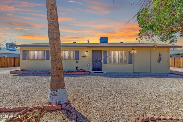 view of front of property featuring fence