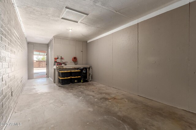 interior space with a workshop area and a textured ceiling