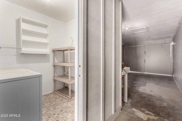 bathroom featuring unfinished concrete flooring and separate washer and dryer