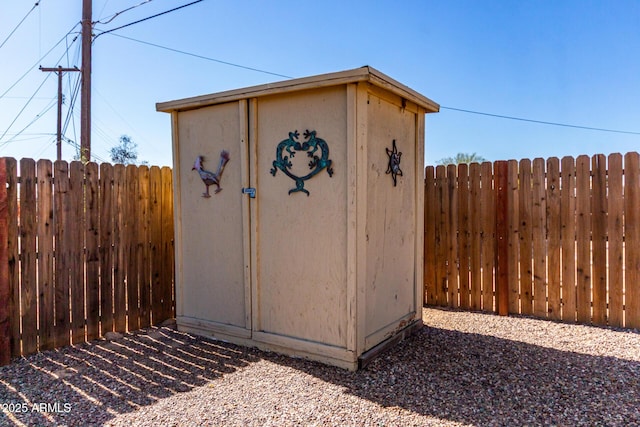 view of shed with fence