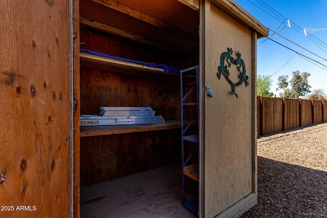 view of outbuilding with fence