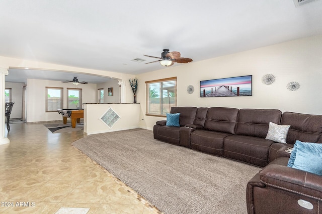 living room with ceiling fan and a wealth of natural light