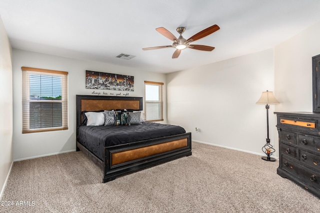 bedroom featuring ceiling fan and carpet