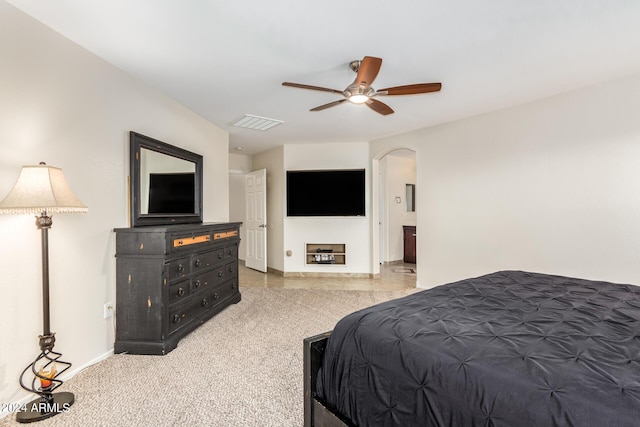 bedroom featuring ceiling fan and carpet