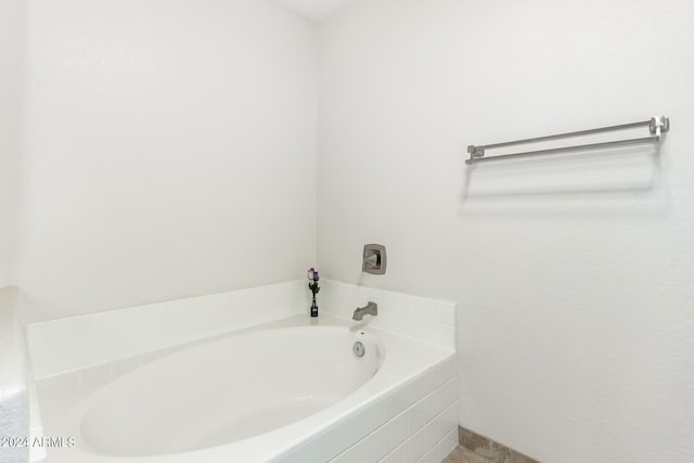 bathroom with tiled bath