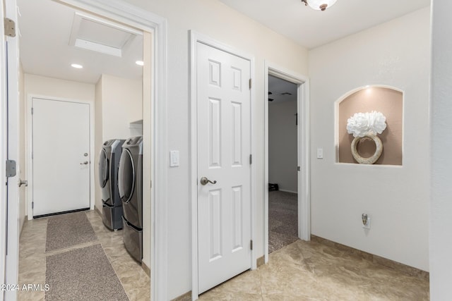 clothes washing area featuring washer and dryer