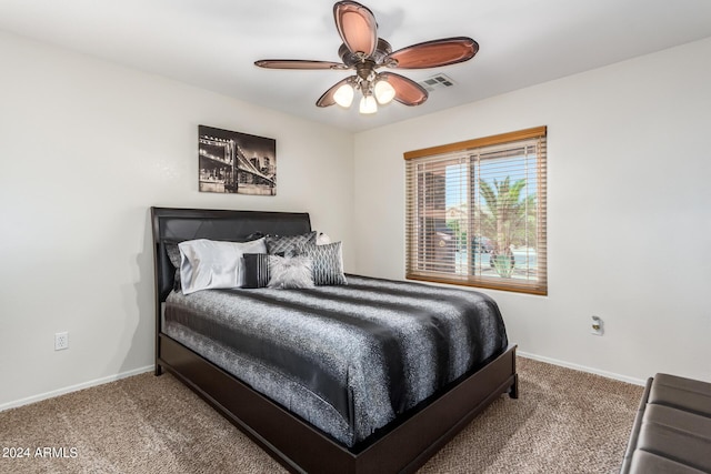 carpeted bedroom with ceiling fan