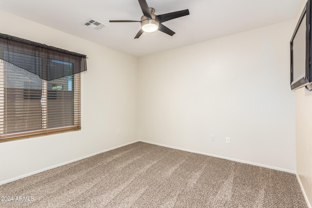 carpeted empty room with ceiling fan