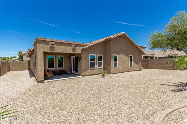 rear view of property with a patio