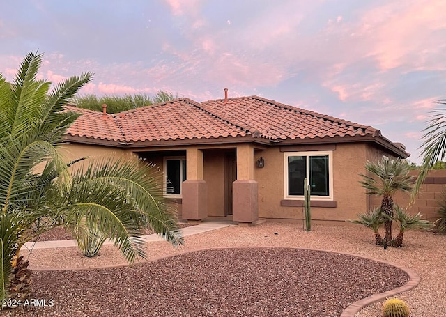 mediterranean / spanish-style house with a patio