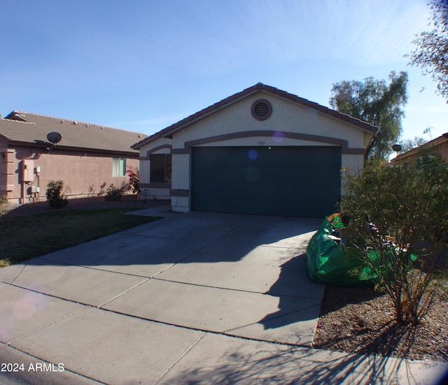 ranch-style house featuring a garage