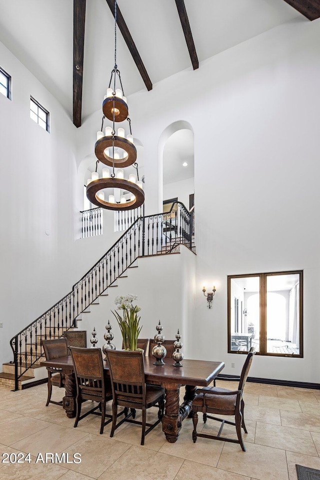 tiled dining area with a notable chandelier, beamed ceiling, and high vaulted ceiling