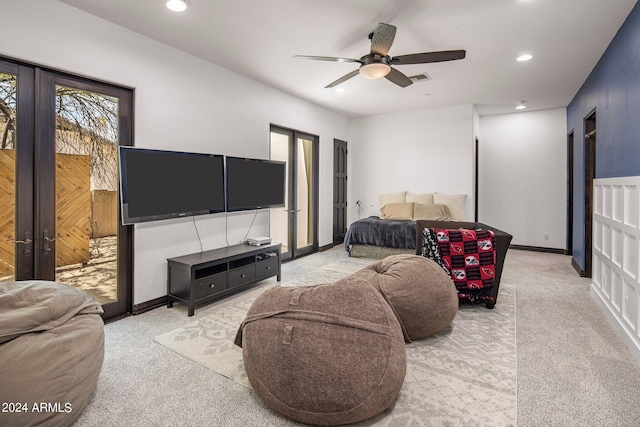 bedroom featuring french doors, light colored carpet, and ceiling fan