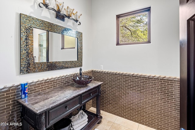 bathroom featuring vanity, tile walls, and tile patterned flooring