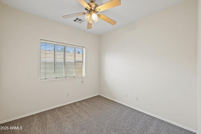 carpeted empty room with visible vents, a ceiling fan, and baseboards