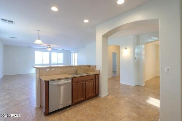 kitchen featuring dishwasher, sink, ceiling fan, and decorative light fixtures