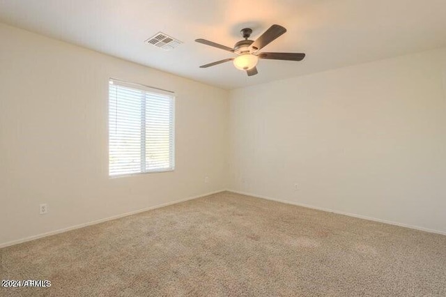 carpeted empty room with ceiling fan