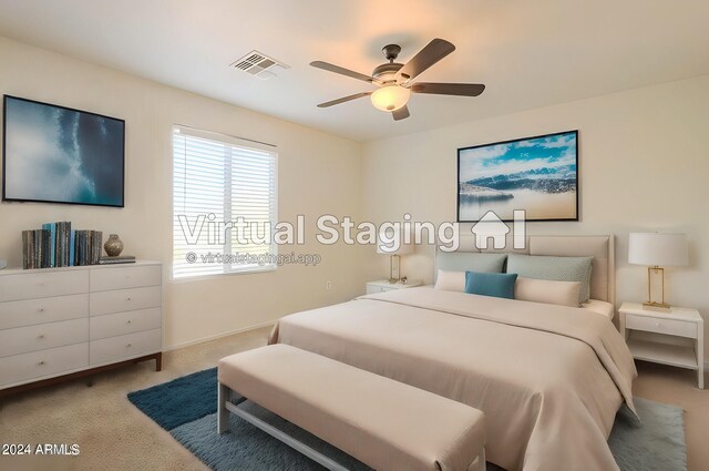 bedroom with light carpet and ceiling fan