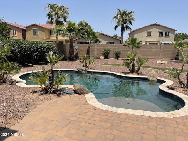 view of swimming pool featuring a patio