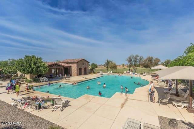 view of swimming pool featuring a patio area