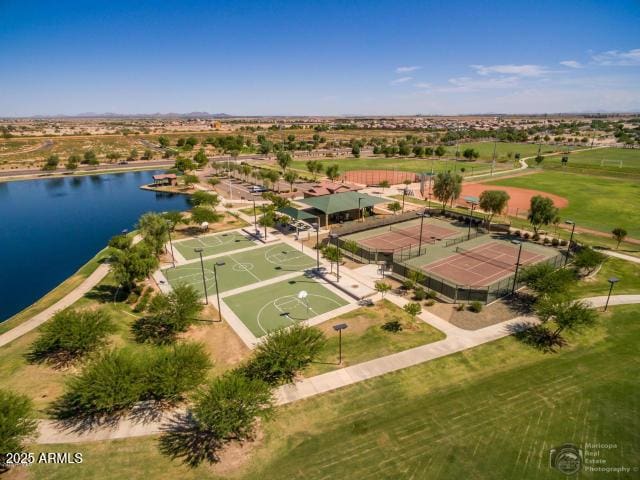 birds eye view of property with a water view