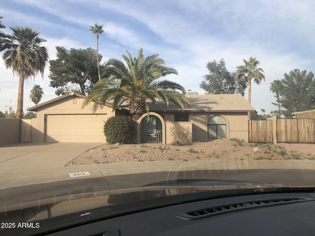 4912 E Columbine Dr, Scottsdale, AZ 85254 - view of front of property featuring driveway, a garage, and stucco siding