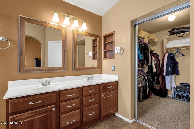 11101 W Wilshire Dr, Avondale, AZ 85392 - bathroom featuring double vanity and a walk in closet