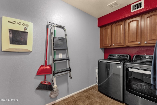 11101 W Wilshire Dr, Avondale, AZ 85392 - laundry area with washing machine and clothes dryer, cabinet space, baseboards, and tile patterned floors