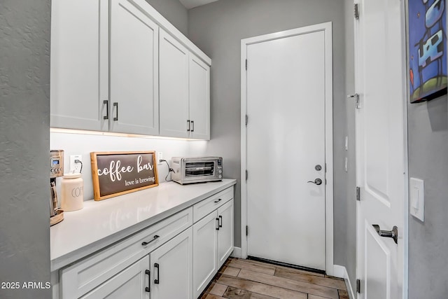 interior space featuring white cabinetry