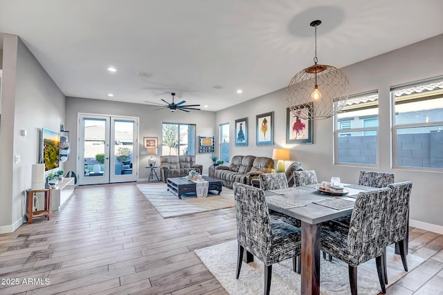 dining area featuring light hardwood / wood-style flooring and ceiling fan