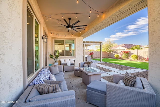 view of patio featuring an outdoor living space with a fire pit