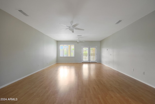 spare room with ceiling fan and hardwood / wood-style flooring