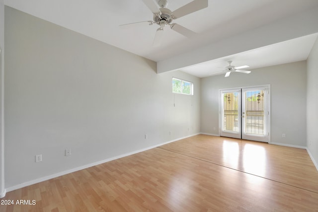 unfurnished room featuring ceiling fan and light hardwood / wood-style flooring