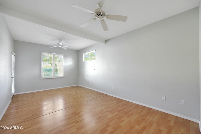 empty room featuring ceiling fan and light hardwood / wood-style flooring