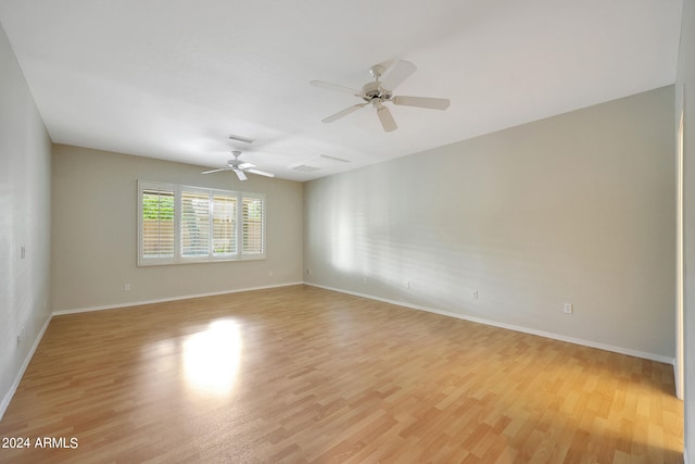 unfurnished room featuring ceiling fan and light hardwood / wood-style flooring