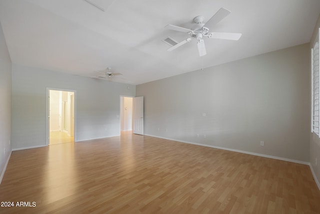 empty room featuring ceiling fan and light hardwood / wood-style floors