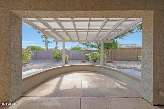 view of patio featuring a pergola