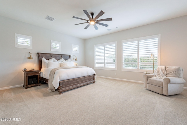 carpeted bedroom with baseboards, visible vents, and ceiling fan