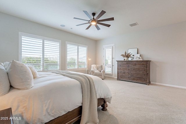 bedroom with light carpet, baseboards, visible vents, and a ceiling fan