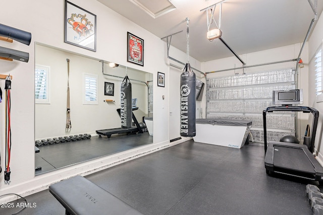 workout area with a garage