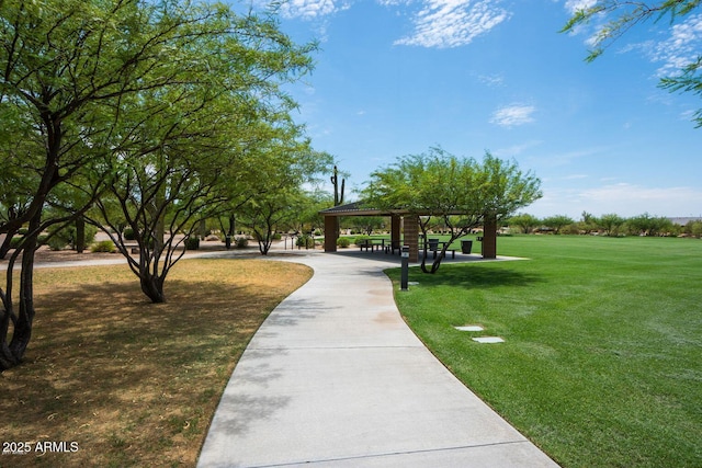 surrounding community with a yard and a gazebo