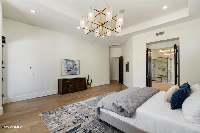 bedroom with recessed lighting, a notable chandelier, visible vents, and light wood finished floors