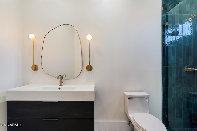 full bathroom with toilet, a tile shower, and vanity