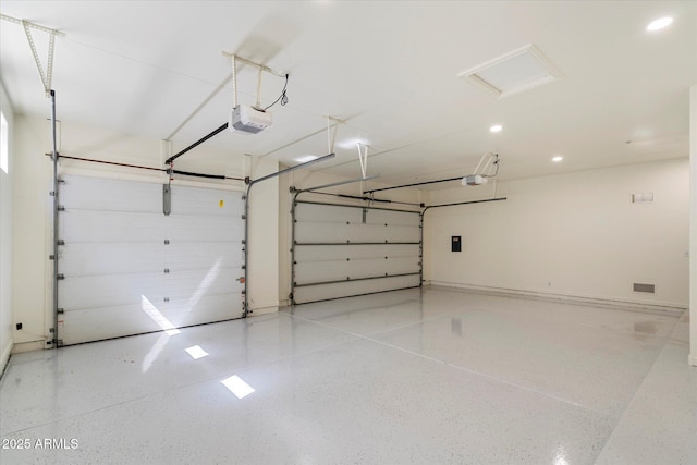 garage with baseboards, a garage door opener, recessed lighting, and visible vents