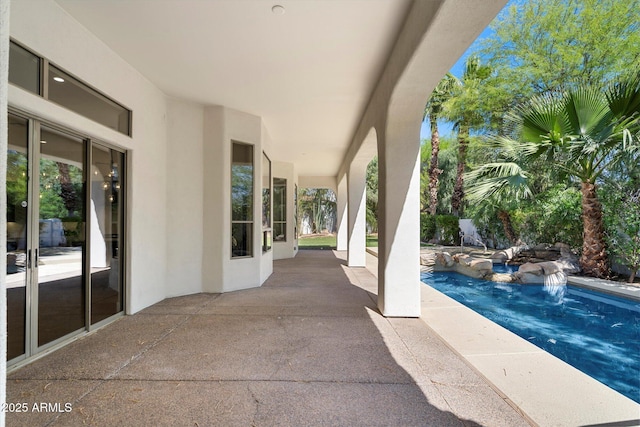 view of patio with an outdoor pool